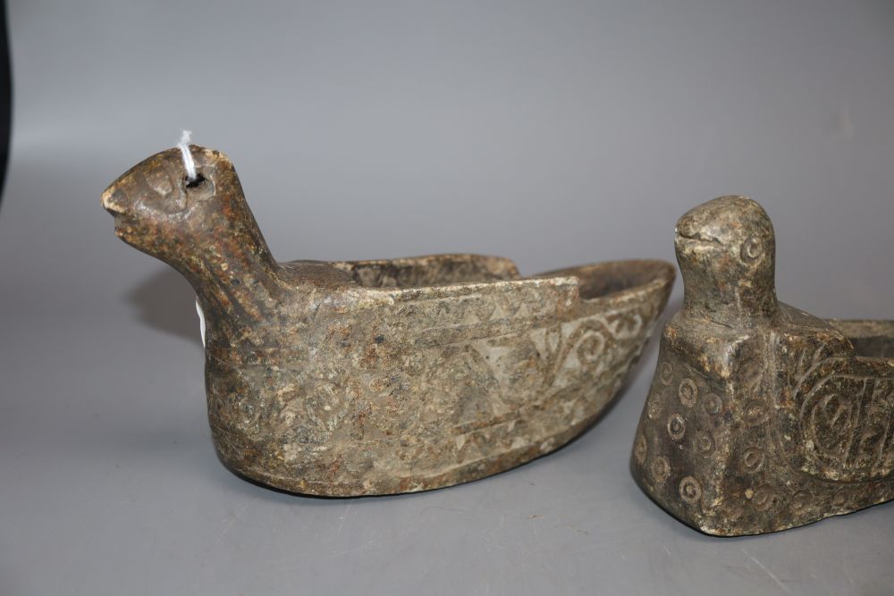 Four Middle Eastern carved stone oil lamps carved in the form of birds, longest 18cm